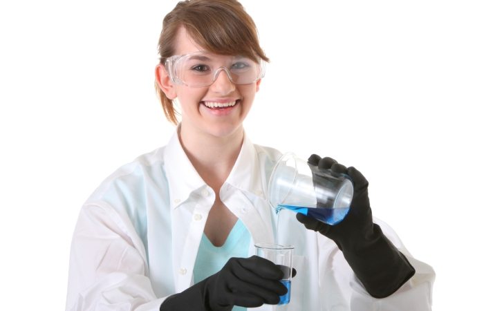 teen female pouring chemicals